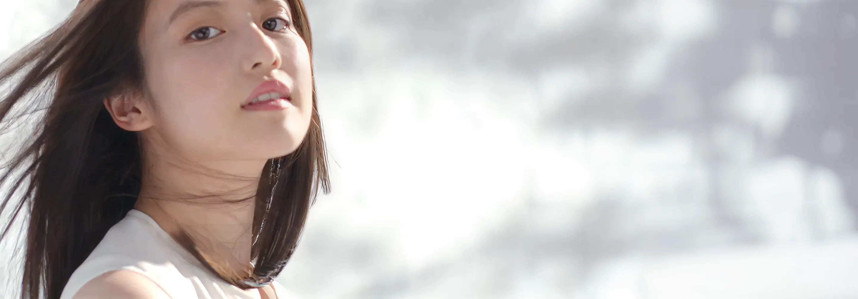Close-up portrait of a woman representing healthy hair